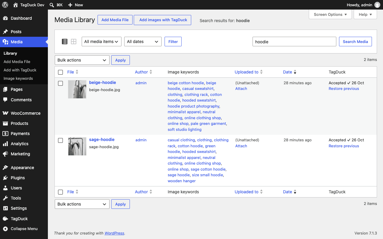 The WordPress Media Library list with an Image keywords column and a TagDuck column showing "Accepted" and a "Restore previous" link for two hoodie photos.
